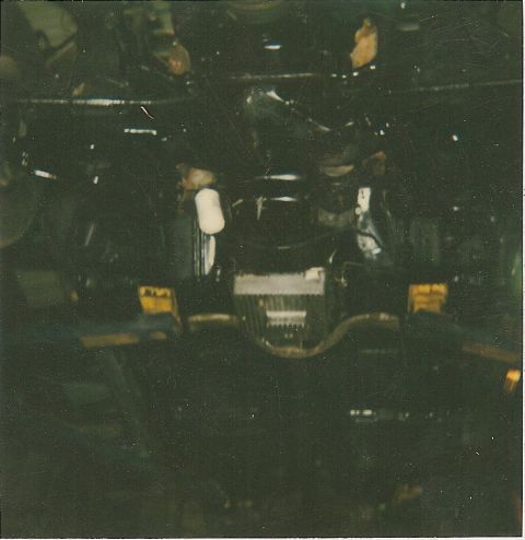 1978 Pontiac Trans Am - Underside view of a dark engine bay with some components visible.