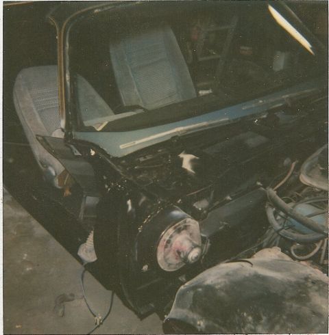 1978 Pontiac Trans Am - The interior and engine bay of a 1978 Pontiac Trans Am are visible, with blue patterned seats and various engine parts.