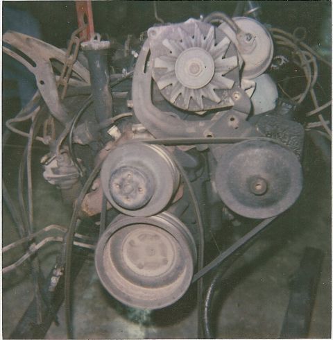 1978 Pontiac Trans Am - Close-up view of engine components including pulleys, alternator, and drive belts.