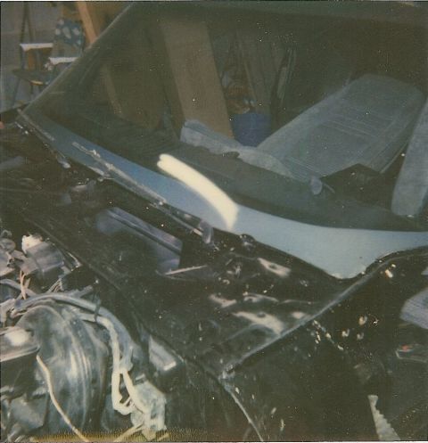 1978 Pontiac Trans Am - Interior view of a car, showing light blue patterned seats and a dark dashboard with windshield wipers.