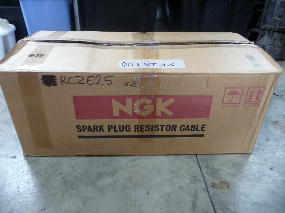 Cardboard box with NGK Spark Plug Resistor Cable label, RCZE25 handwritten