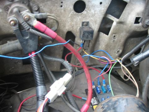 1992 Ford Bronco - Vehicle fuse block and associated wiring harness, showing multiple connections and fuses.
