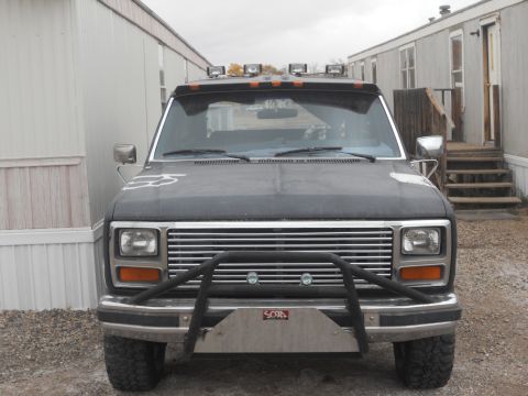 1986 Ford Bronco - This Ford Bronco features a custom brush guard and multiple lights mounted on its roof visor.
