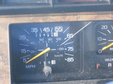 1986 Ford Bronco - Dashboard gauges showing speed and RPM. The odometer reads 00000.