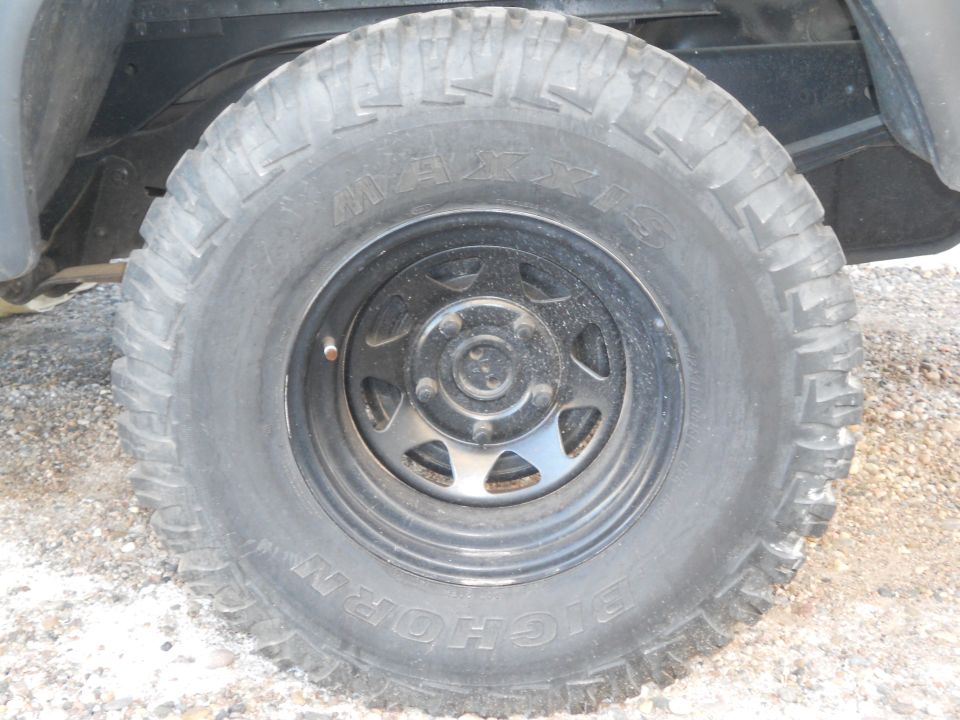 Close-up of a BFG All-Terrain T/A tire on a black wheel