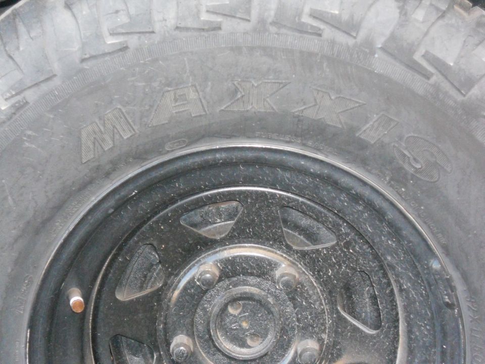 Maxxis tire on a black wheel