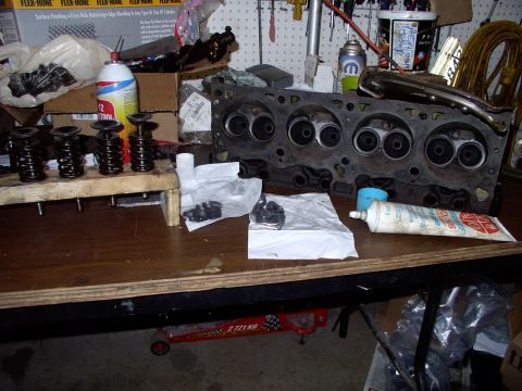 1983 Chrysler Fifth Avenue - Got the new seals, assembly lube, lapped valves all ready to go into the heads with my buddy's valve spring compresser, on top of the head.