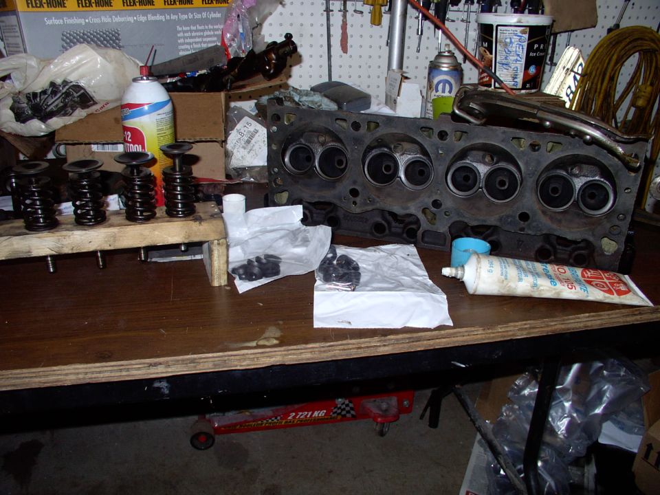 Got the new seals, assembly lube, lapped valves all ready to go into the heads with my buddy's valve spring compresser, on top of the head.