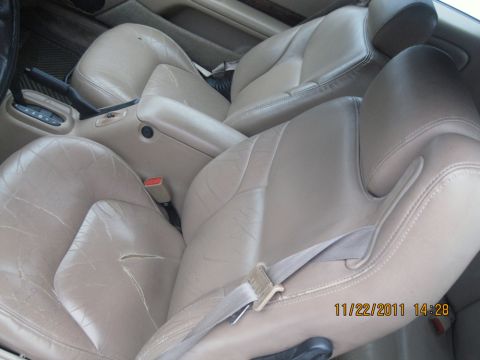 1984 Chevrolet C/K Pickup - Interior view of tan leather bucket seats and center console. The image has a date stamp of 11/22/2011.