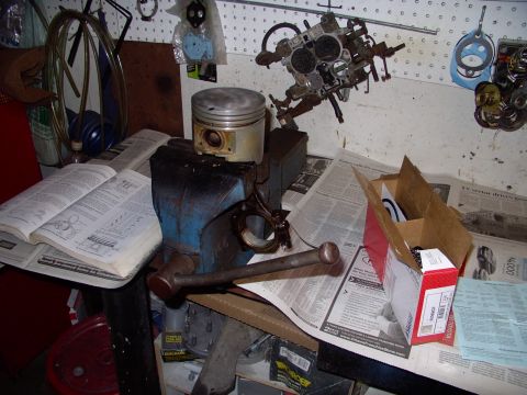 1983 Chrysler Fifth Avenue - Cleaned piston ready for new rings, in box to right. Mahle instructions further right and the ever present factory service manual on the le…