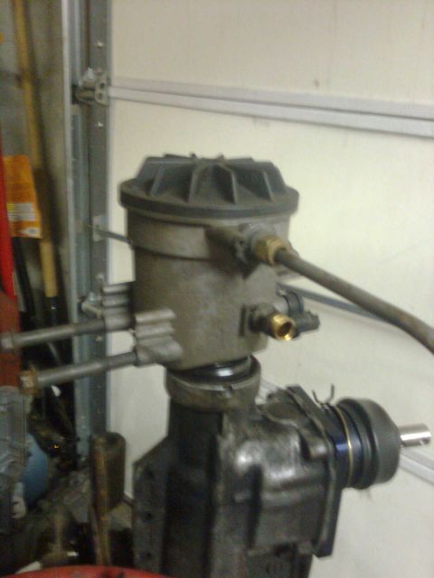 1984 Ford Bronco - Close-up view of a fuel filter housing, likely part of a supercharger installation.