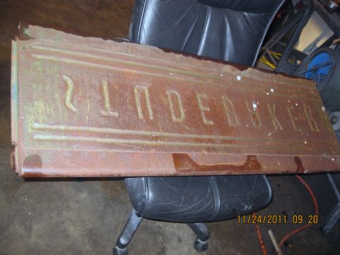 1984 Chevrolet C/K Pickup - A rusty tailgate with "STUDEBAKER" embossed into the metal is shown.