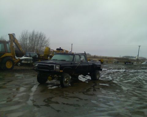 1978 Chevrolet C/K Pickup - This 1978 Chevrolet C/K Pickup is seen in a muddy lot under an overcast sky.