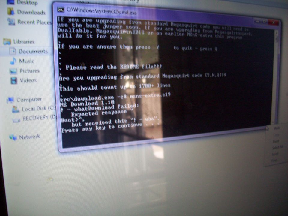 Computer screen showing command prompt text about upgrading Megasquirt code