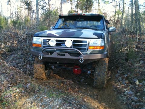 1995 Ford Bronco - This modified Ford Bronco navigates a challenging off-road course.