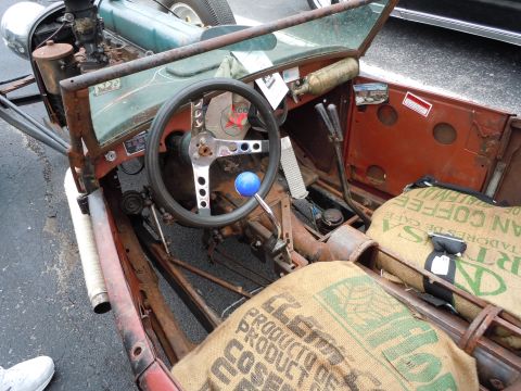 1982 Chevrolet Camaro - A custom hot rod's interior shows burlap coffee sack seats and a prominent aftermarket steering wheel.
