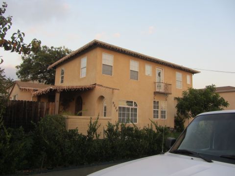 1968 Ford Mustang - House with address 9034 decorated with lights, front corner of white vehicle visible.