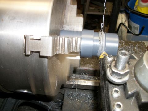 1996 Ford Bronco - Machining a pipe on a metal lathe, creating metal shavings.