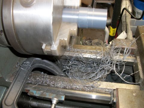 1996 Ford Bronco - Metal shavings accumulate on the bed of a lathe after a machining operation.