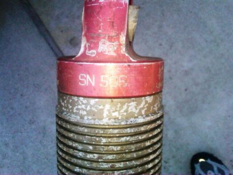 1986 Ford Bronco - A close-up shows a red and brass component with visible serial number SN 505.
