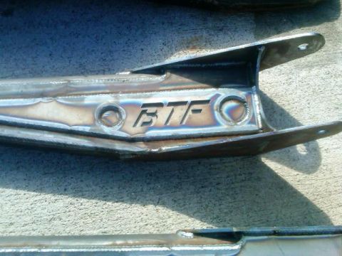 1986 Ford Bronco - Close-up of custom metal fabrication parts with "BTF" logo visible.