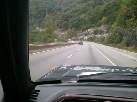 1989 Ford Bronco - Driving on a highway with other vehicles visible ahead.
