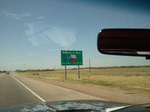 1989 Ford Bronco - Driving into Texas, a sign welcomes visitors to the Lone Star State.