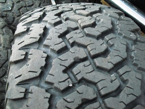 1986 Ford Bronco - Close-up of the aggressive tread pattern on a BFGoodrich All-Terrain T/A tire.