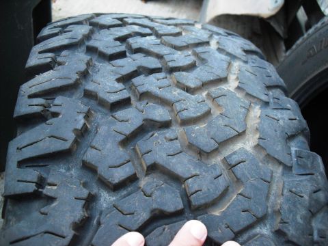 1986 Ford Bronco - Close-up view of a tire's aggressive tread pattern.