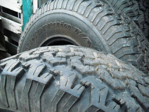 1986 Ford Bronco - Tires are the only visible subject, not a 1986 Ford Bronco.