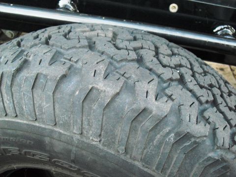 1986 Ford Bronco - Close-up of a BFGoodrich All-Terrain tire tread pattern, showing the aggressive lug design.