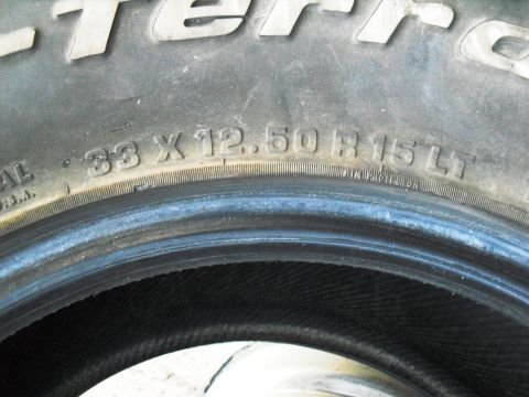 1986 Ford Bronco - A close-up view of a BFGoodrich All-Terrain T/A tire, showing its size markings.