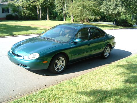 1997 Ford Taurus - This 1997 Ford Taurus sedan is shown from a 3/4 front angle, parked on a sunny day.