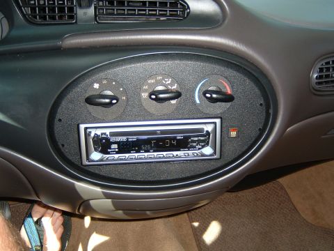 1997 Ford Taurus - Dashboard view of a 1997 Ford Taurus, climate controls and an aftermarket Kenwood stereo unit.