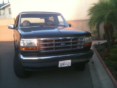 1993 Ford Explorer - This Ford Bronco features a prominent chrome grille and a California license plate.