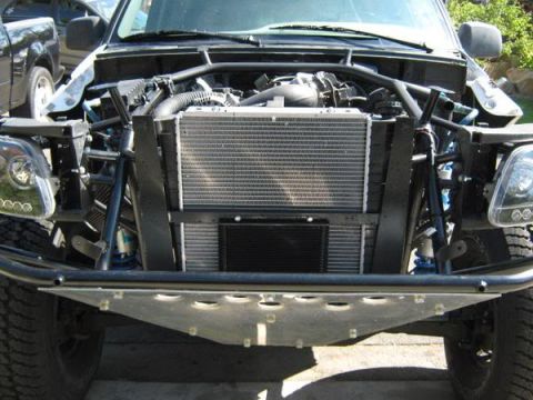 1993 Ford Explorer - Custom front end of an off-road truck, showing engine and radiator components. A second vehicle is visible on the left.