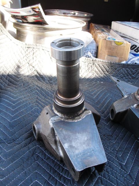 1986 Ford Bronco - A close-up view of a spindle assembly, likely for a vehicle's suspension system.