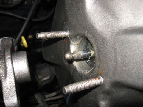 1981 Ford Bronco - Close-up view of a brake booster pushrod, showing the threaded mounting studs and the connection point.