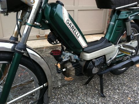1981 Garelli Rally Sport - Close-up view of a green Garelli moped, showing the fuel tank and engine details.