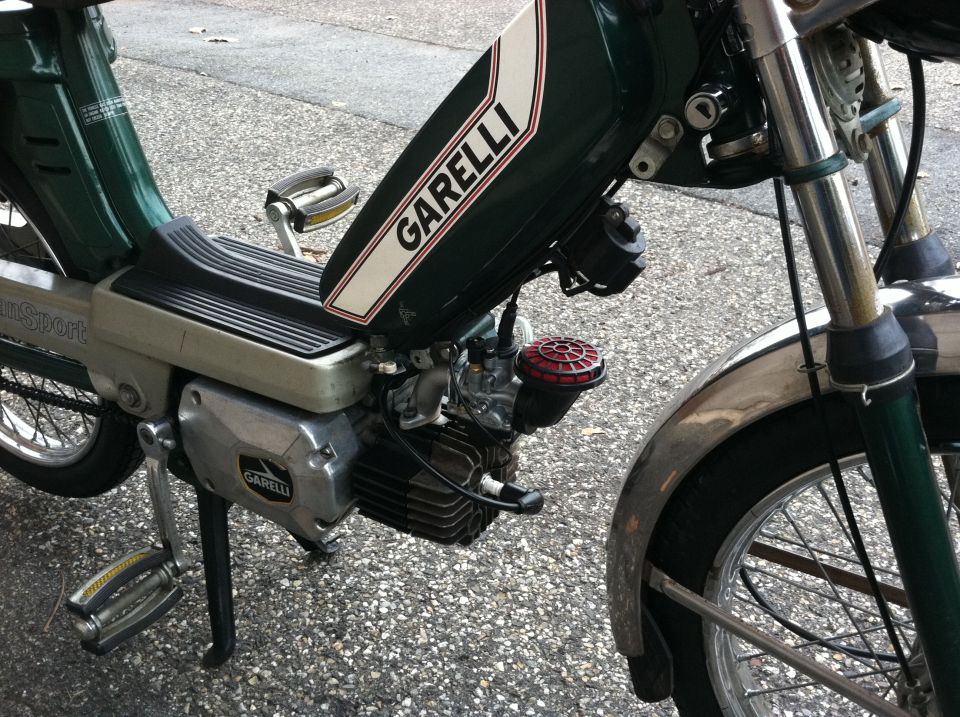 Green moped with 'GARELLI' text on the fuel tank, chrome fenders, and pedals