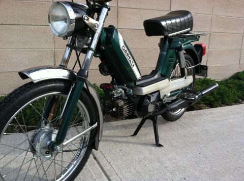 1981 Garelli Rally Sport - Green Garelli moped with chrome fenders and a black seat.