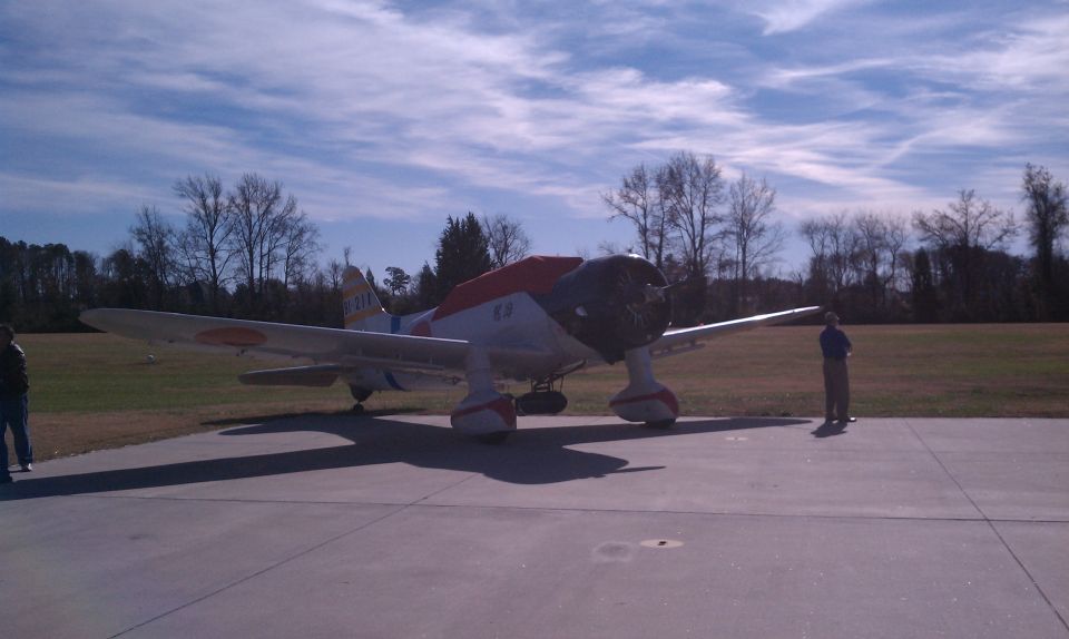 Airplane with red accents on a tarmac