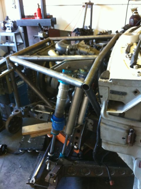 1992 Ford Ranger - Custom off-road chassis with exposed engine and suspension components visible in a workshop setting.