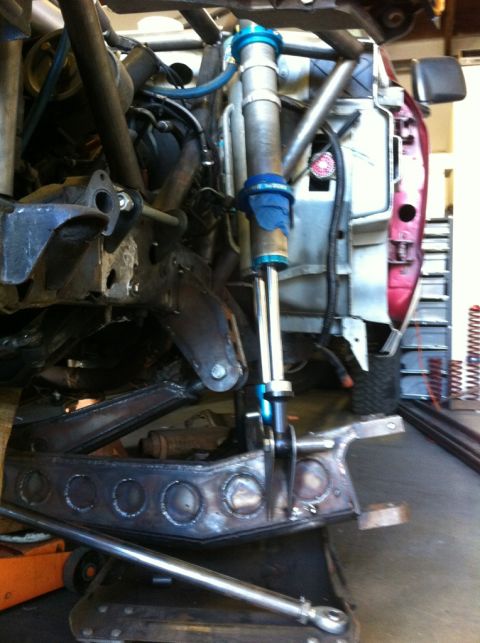 1992 Ford Ranger - Close-up view of a vehicle's modified suspension system, heavy-duty components and a large shock absorber.