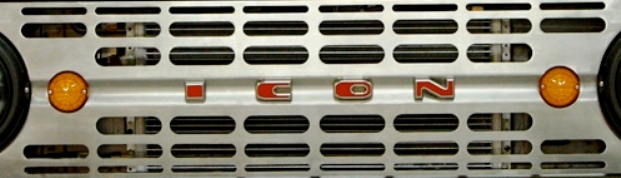 Close-up of the ICON badge on a silver grille with orange marker lights