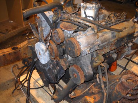 1988 Ford F-250 - Rusty Ford 7.3L IDI V8 engine assembly, likely removed for rebuild.