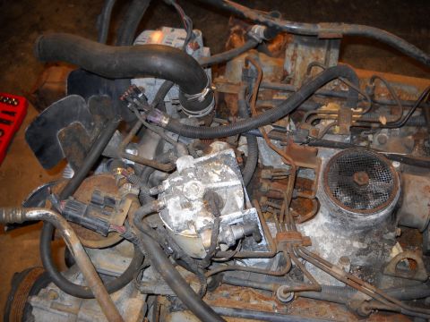1988 Ford F-250 - Engine components are heavily corroded and show signs of wear and tear.