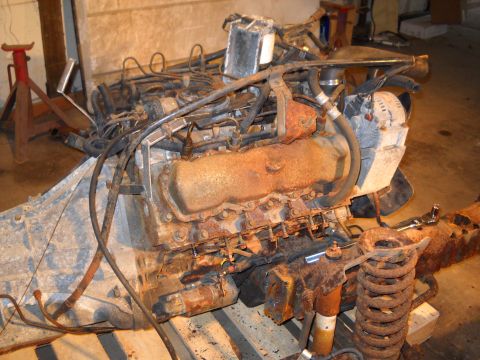 1988 Ford F-250 - Engine and chassis components are shown in a state of disrepair.