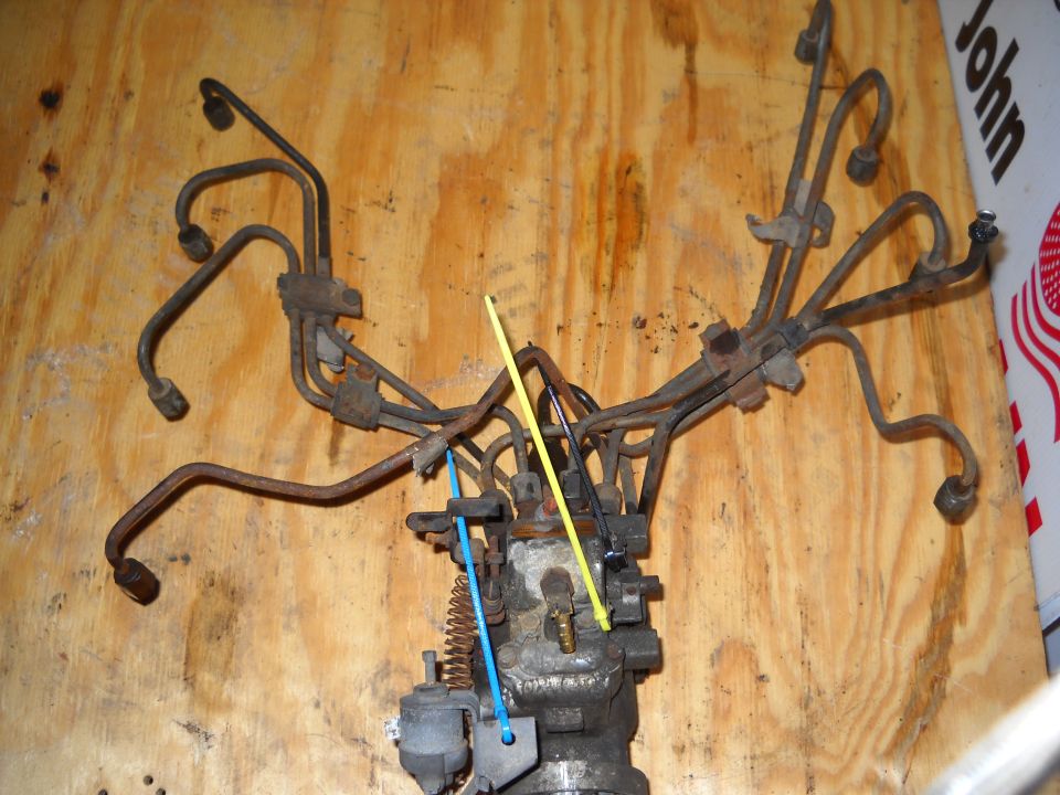 Fuel injection pump with numerous metal lines attached