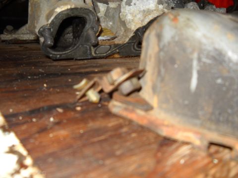 1988 Ford F-250 - Close-up view of engine components, possibly from a Ford F-250, resting on a wooden surface.